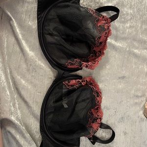 Cacique 44g underwire bra. Black with pink flower detail. Sheer cup, deep v cut
